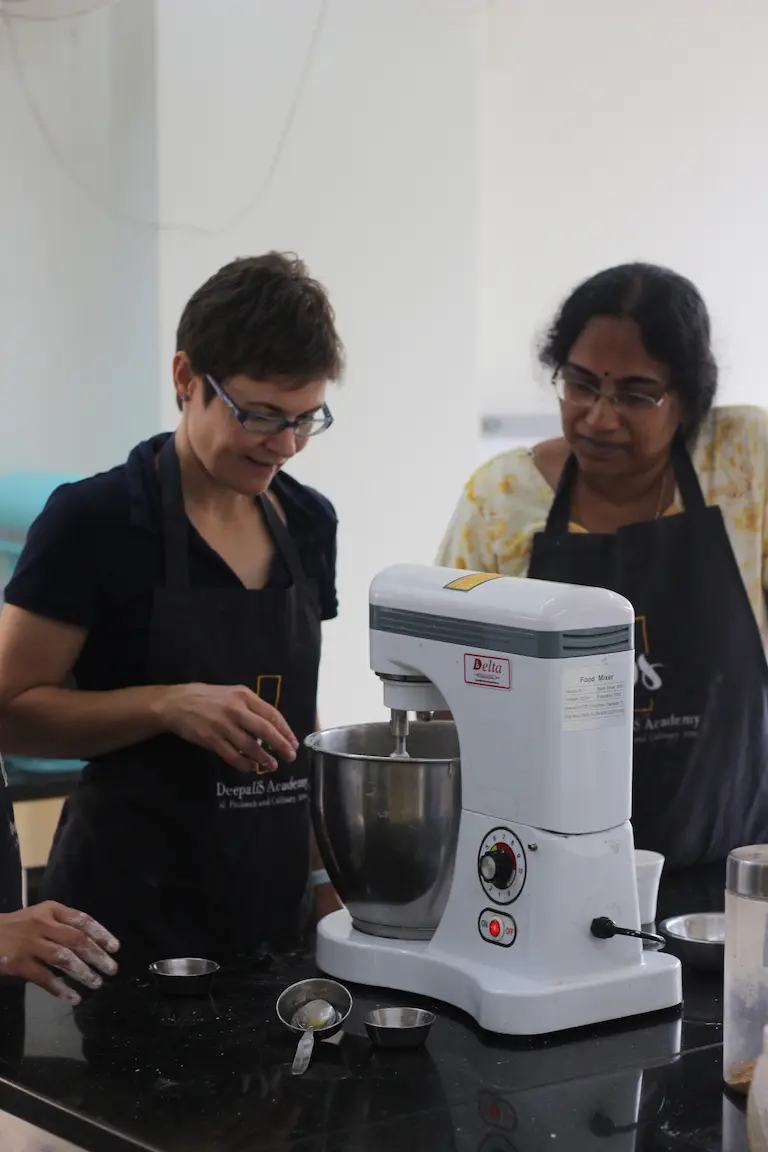 Shaping artisan sourdough loaves during a baking workshop